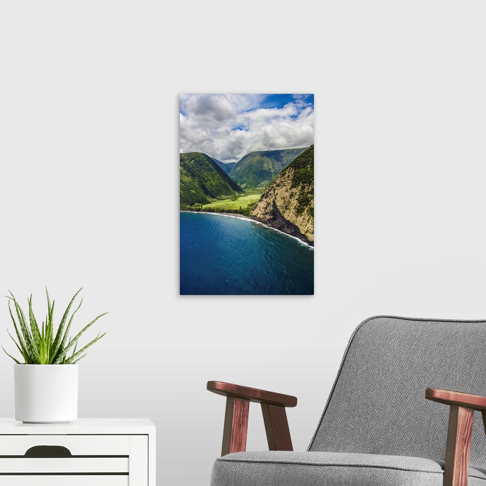 A modern room featuring The big island's stunning Waipi'o Valley from offshore