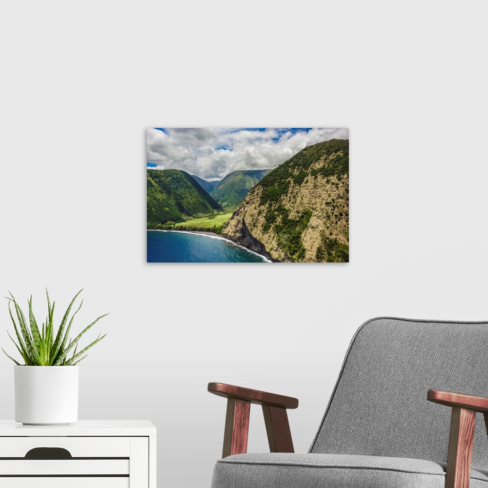 A modern room featuring The big island's stunning Waipi'o Valley, seen from offshore