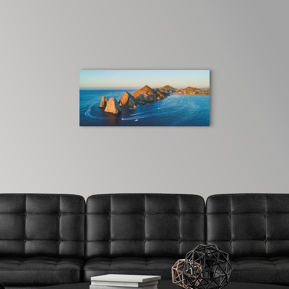 A modern room featuring The Cabo arch lights up at sunset.