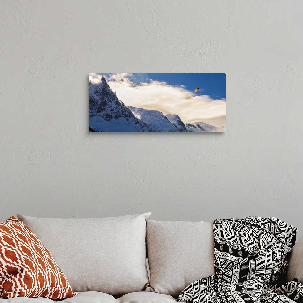 A bohemian room featuring Photograph of Mont Blanc with a parachuter enjoying the views