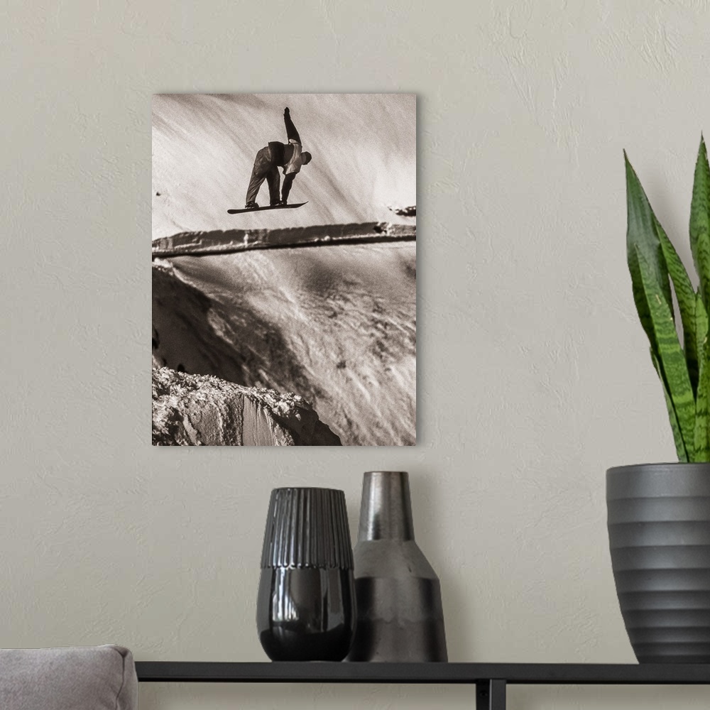 A modern room featuring Black and white image of Tracy Latzen grabbing his snowboard in hte air at Donner Summit, Califor...