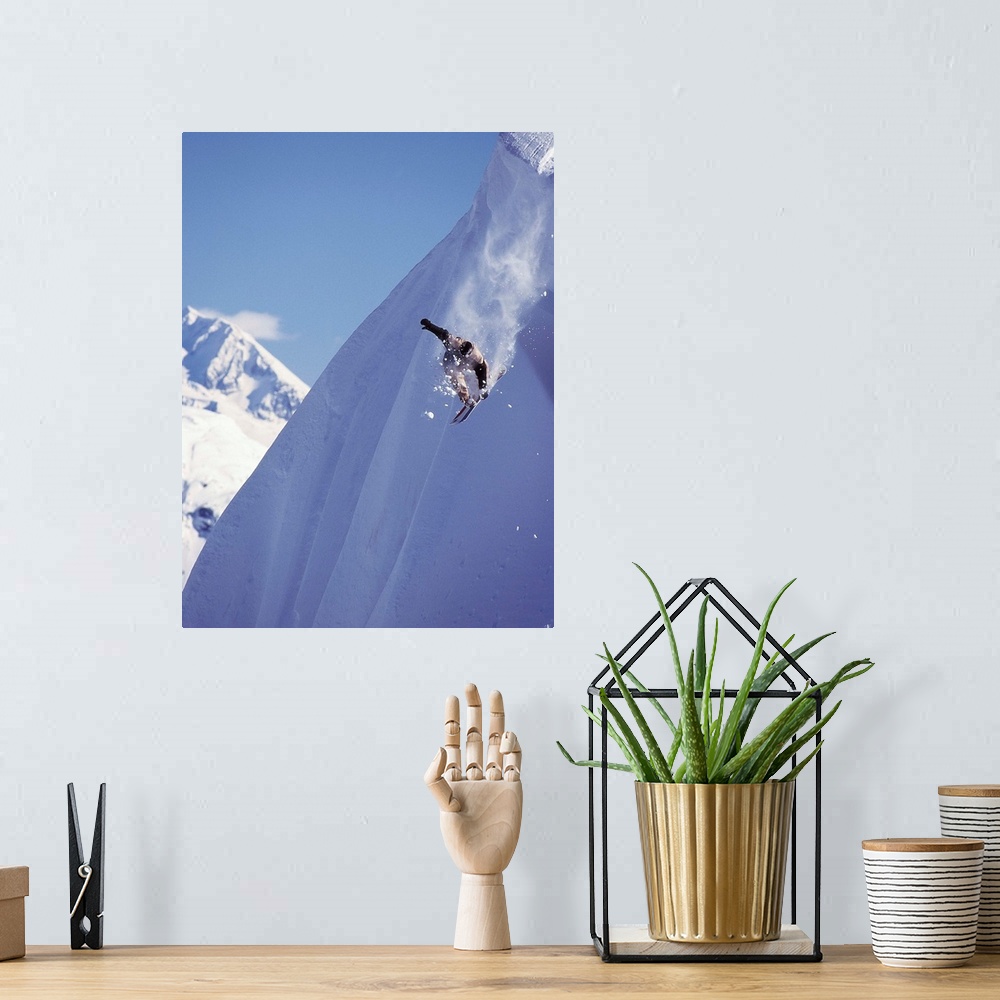 A bohemian room featuring Travis Parker snowboarding down a steep mountainside at Whistler, British Columbia, Canada.