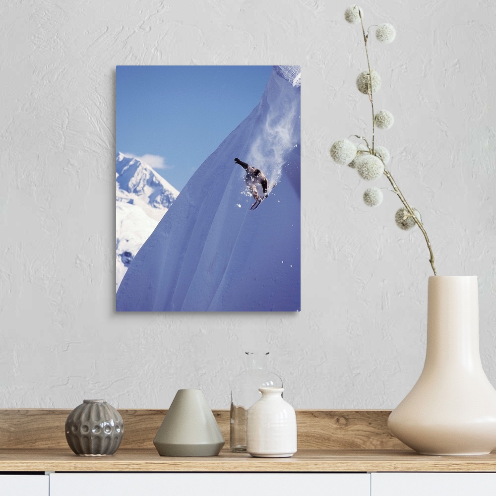 A farmhouse room featuring Travis Parker snowboarding down a steep mountainside at Whistler, British Columbia, Canada.