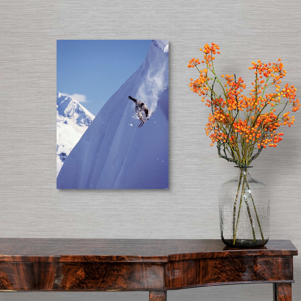 A traditional room featuring Travis Parker snowboarding down a steep mountainside at Whistler, British Columbia, Canada.