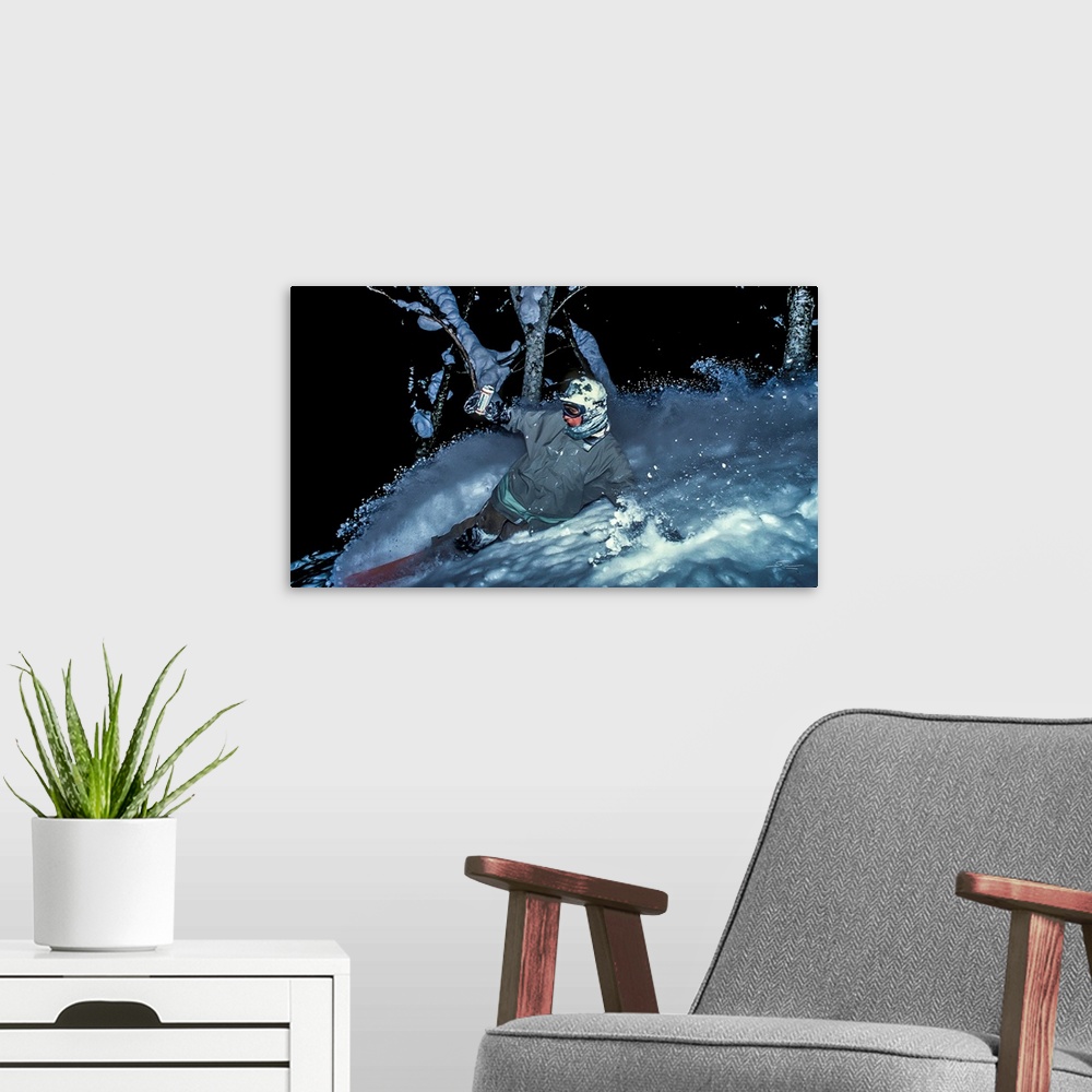 A modern room featuring Vintage photo of Mike Ranquet as he rides some night powder while enjoying a beer in Niseko, Japa...