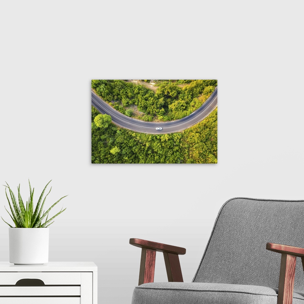 A modern room featuring Aerial View Of Road With Car In Beautiful Forest At Sunset In Summer