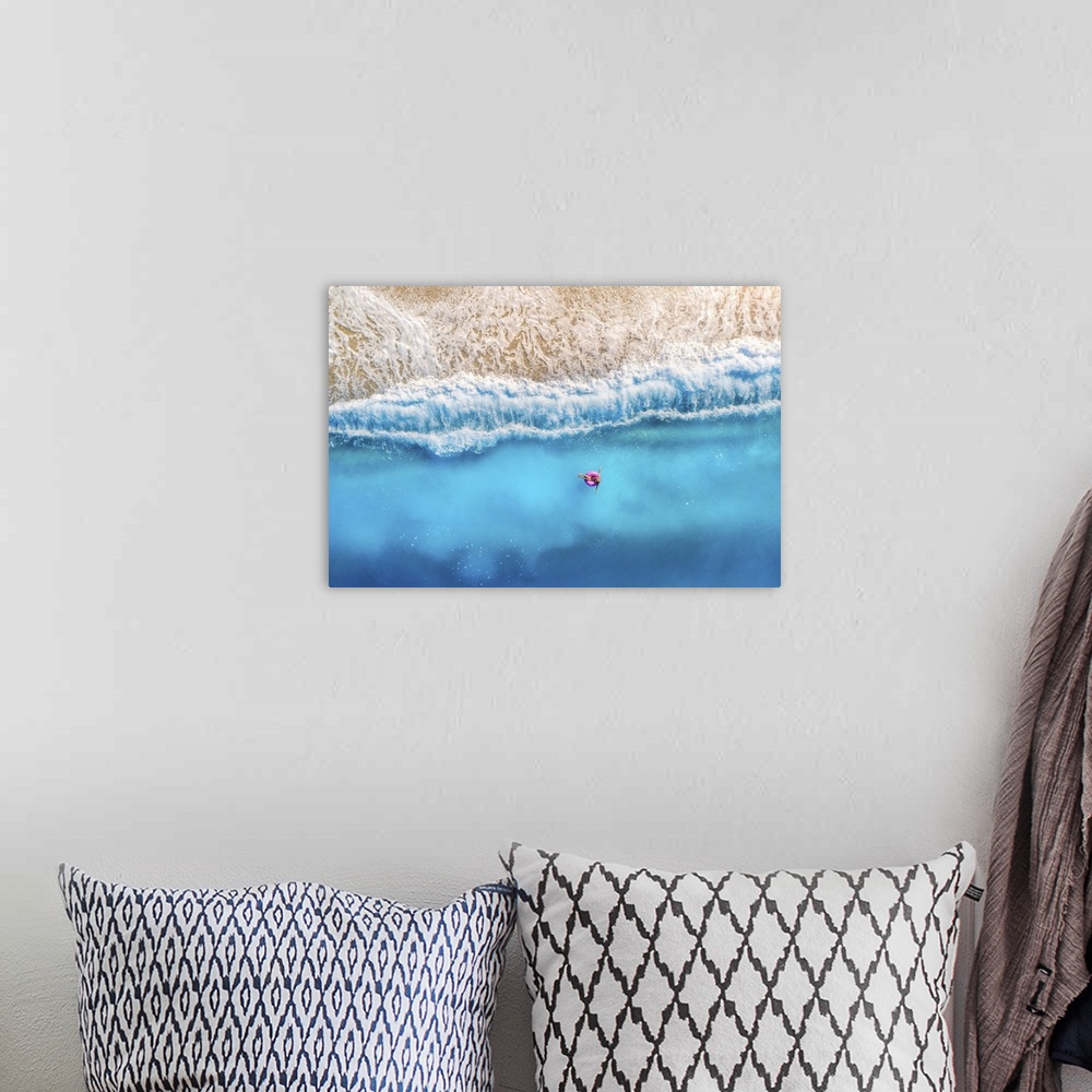 A bohemian room featuring Aerial View Of Woman With Donut Float In The Transparent Blue Sea At Sunset In Summer