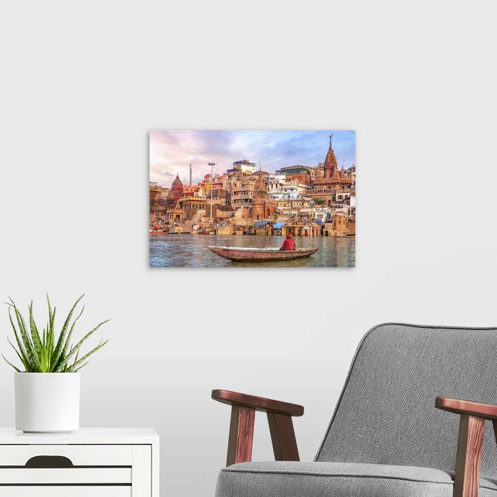 A modern room featuring Ancient Varanasi City At Sunset With Sadhu Baba Enjoying A Boat Ride On The River Ganges