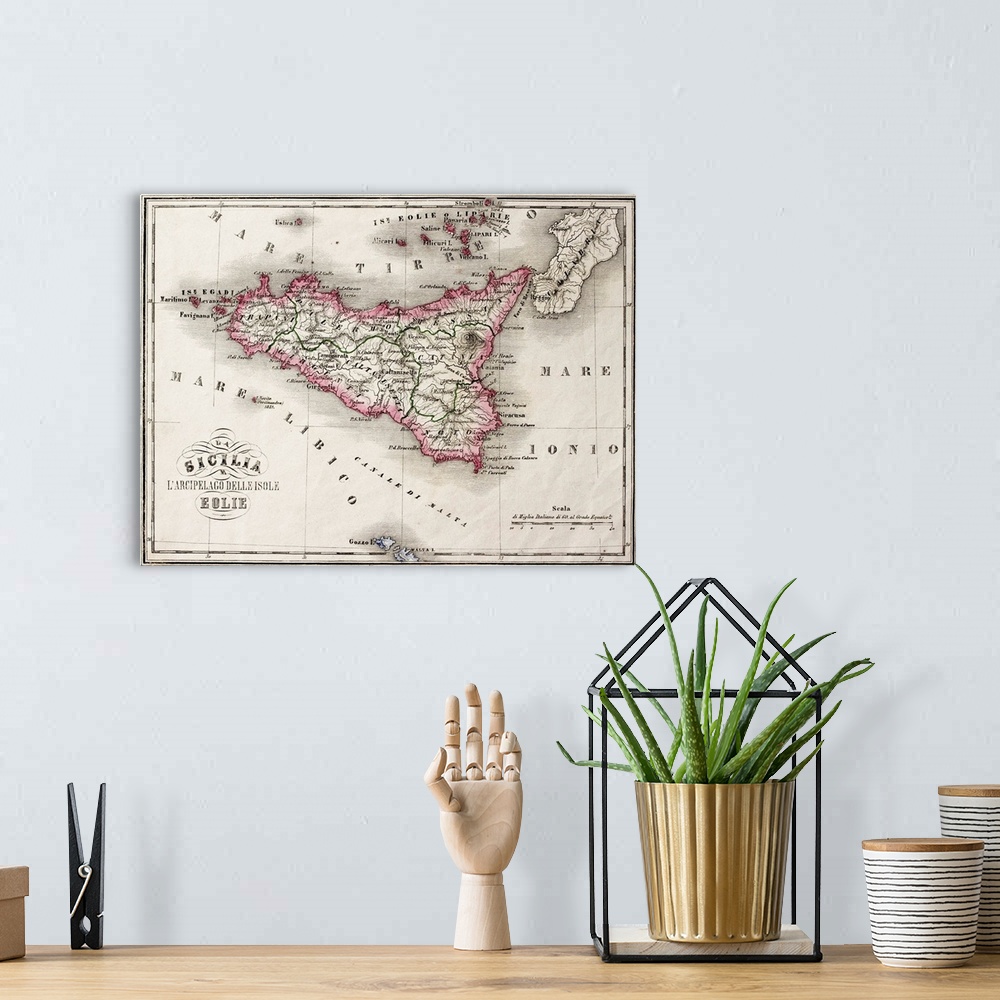 A bohemian room featuring An old map of Sicily and little islands around it. The original map was published in Italy in 1860,