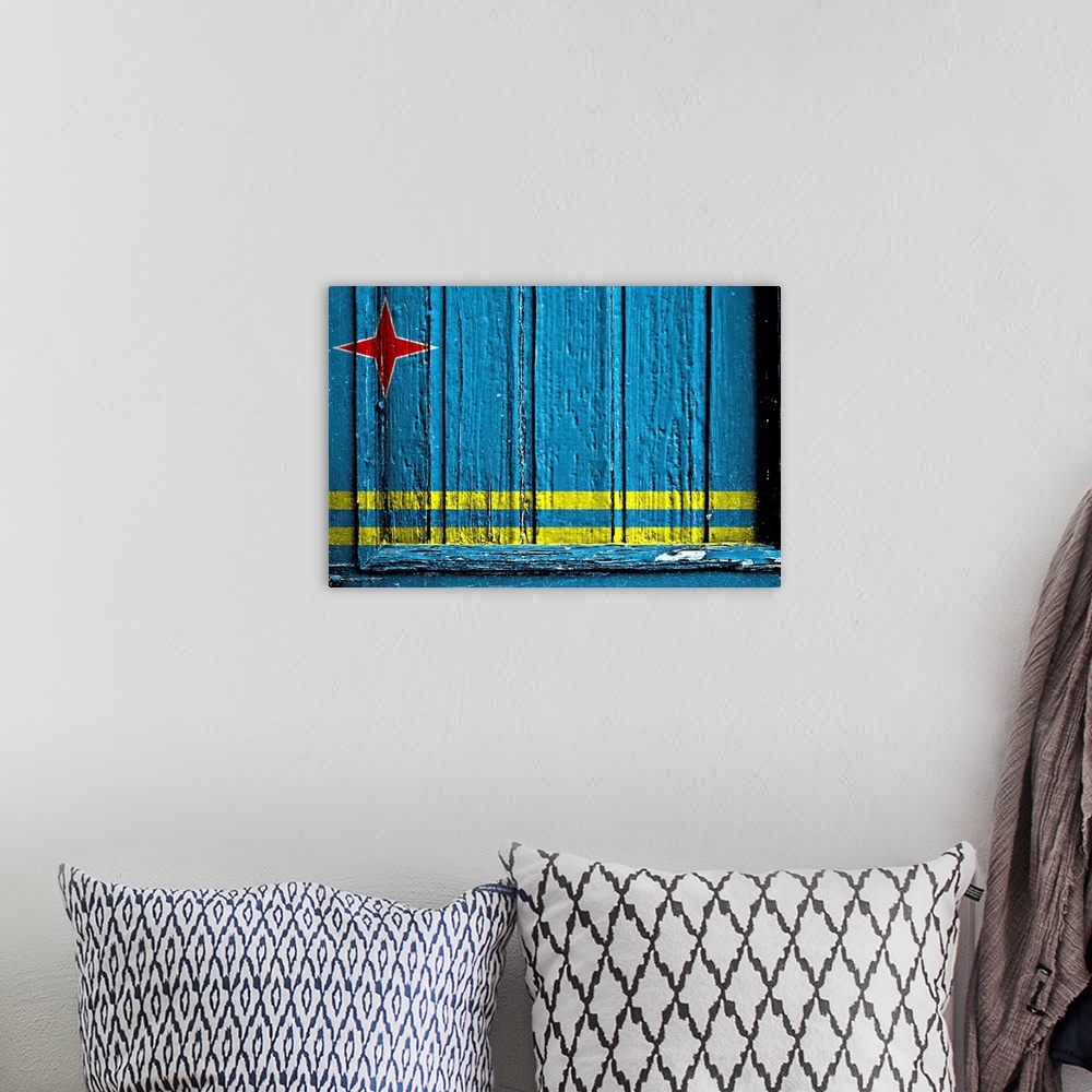 A bohemian room featuring Flag of Aruba painted on wooden rustic wooden surface.