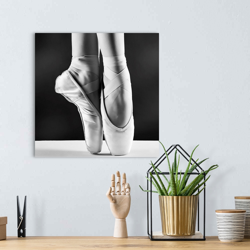 A bohemian room featuring A Photo Of Ballerina's Pointes On Black Background