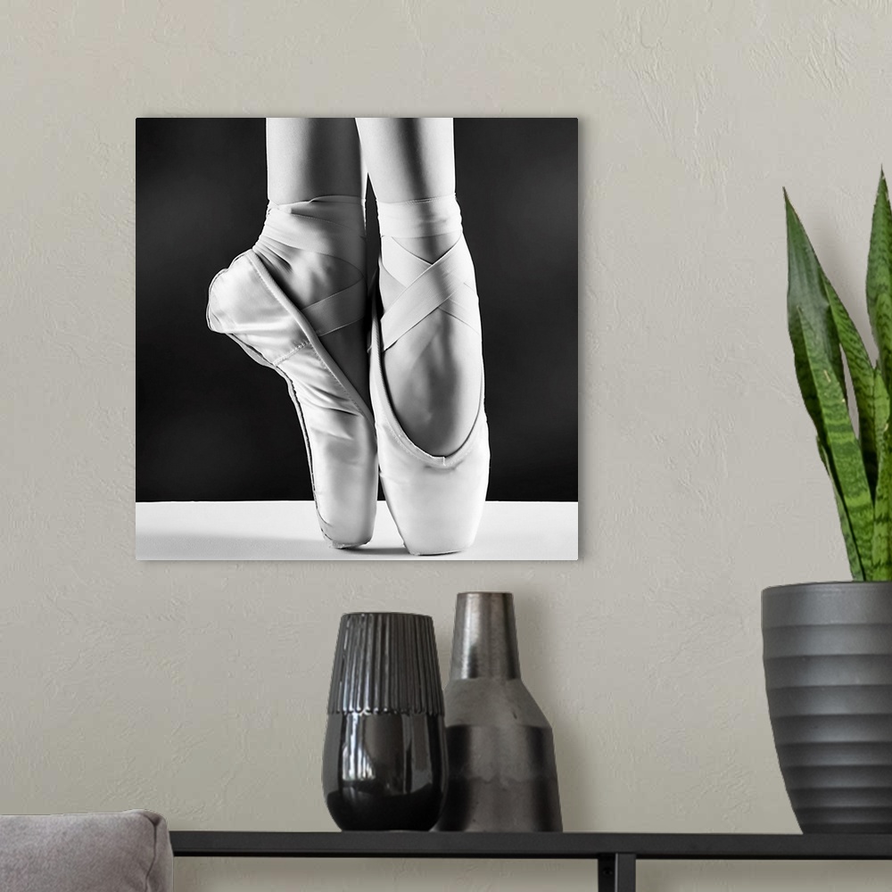 A modern room featuring A Photo Of Ballerina's Pointes On Black Background