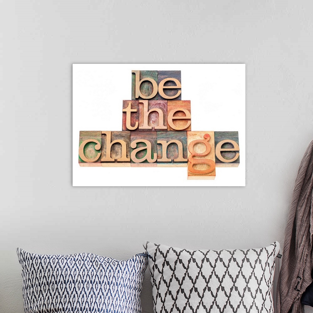 A bohemian room featuring be the change - inspiration concept - isolated text in vintage letterpress wood type printing blocks