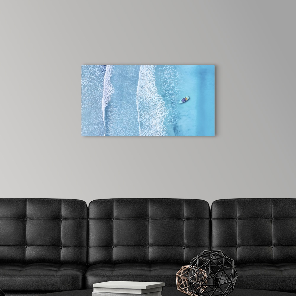 A modern room featuring Beach and waves from top view. Turquoise water background from top view. Summer seascape from air...