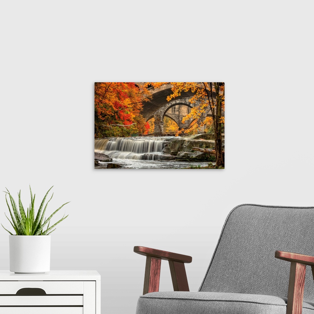 A modern room featuring Berea Falls, Ohio, during peak fall colors. This cascading waterfall looks it's best with peak au...