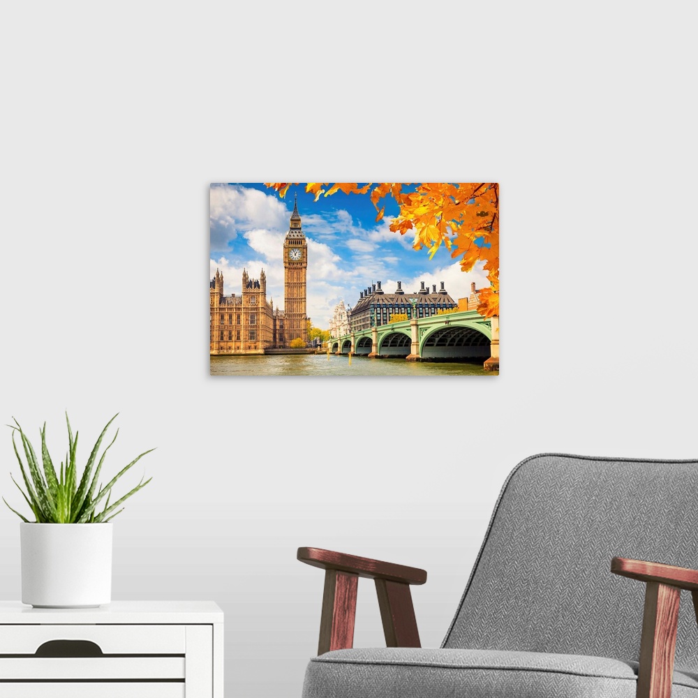 A modern room featuring Big Ben with autumn leaves, London.