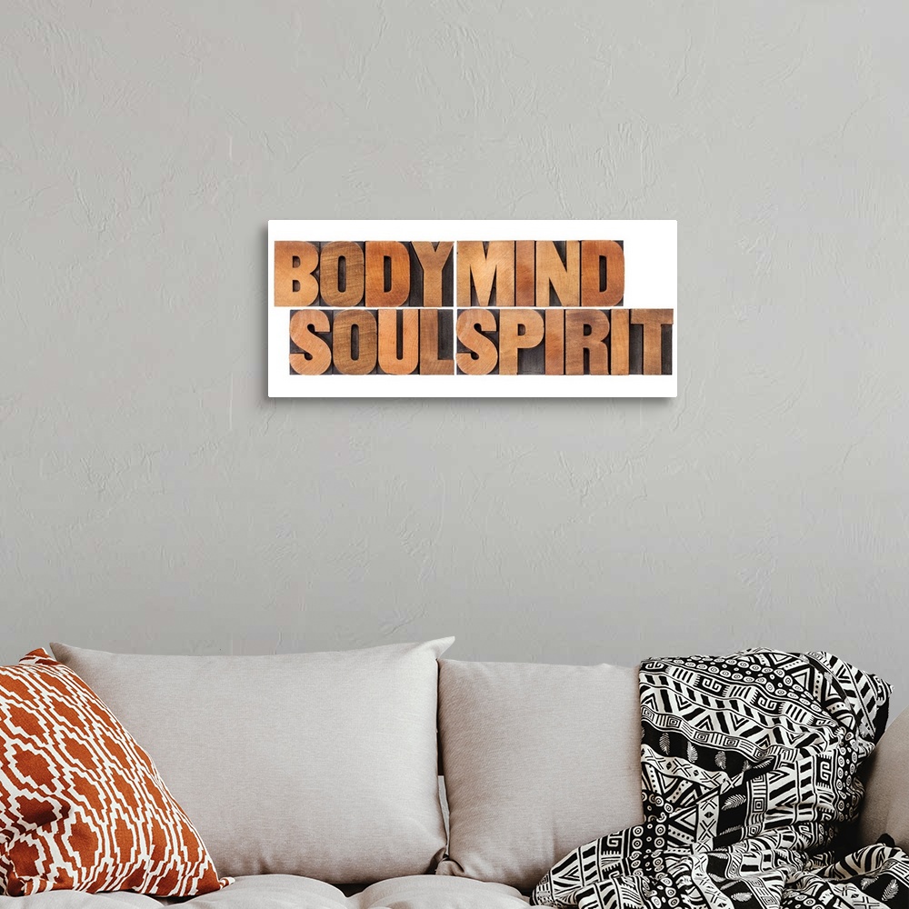 A bohemian room featuring body, mind, soul and spirit - a collage of isolated words in vintage wood letterpress printing block