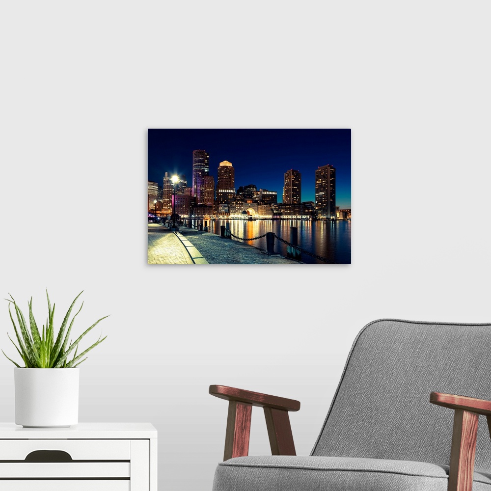 A modern room featuring Boston skyline by night - Massachusetts