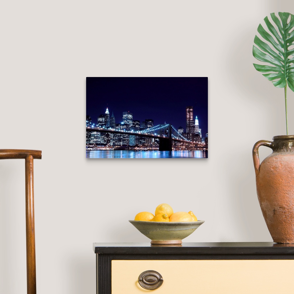 A traditional room featuring Brooklyn Bridge and Manhattan Skyline At Night, New York City.