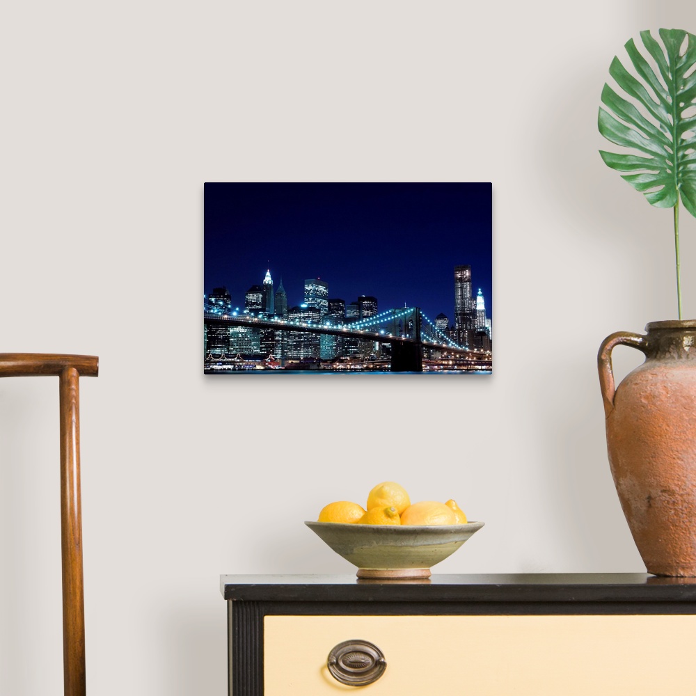 A traditional room featuring Brooklyn Bridge and Manhattan Skyline At Night, New York City.