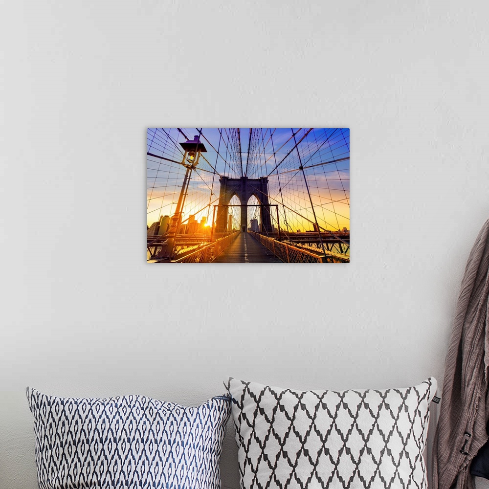 A bohemian room featuring Brooklyn Bridge at sunset in New York City.