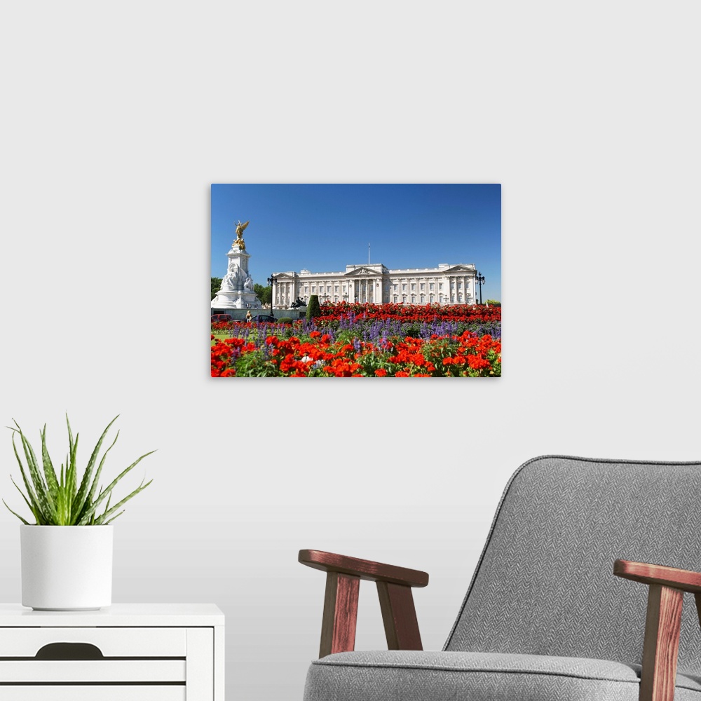 A modern room featuring Buckingham Palace With Flowers Blooming In The Queen's Garden, London, England.