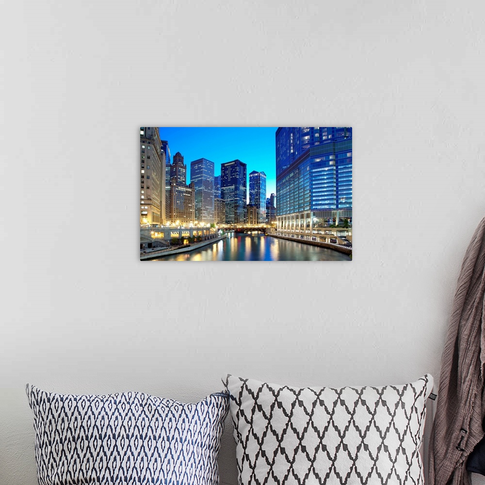 A bohemian room featuring Chicago skyline along the river just after sunset.