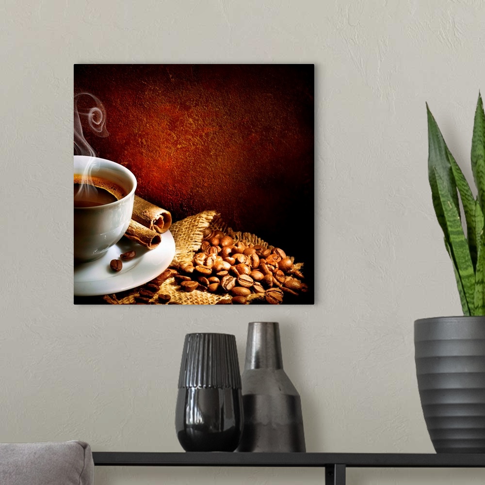 A modern room featuring Coffee in a white cup sitting atop a burlap and coffee beans.
