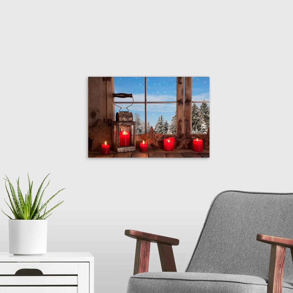 A modern room featuring Country Christmas decoration: wooden window decorated with red candles and lantern.