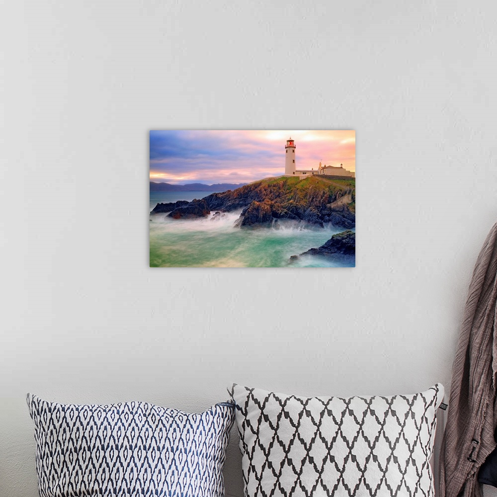 A bohemian room featuring Fanad Lighthouse sits on cliffs above stormy bay Co. Donegal Ireland.