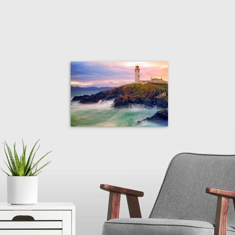 A modern room featuring Fanad Lighthouse sits on cliffs above stormy bay Co. Donegal Ireland.