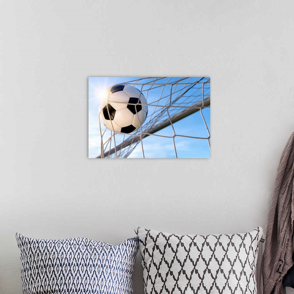 A bohemian room featuring Football Goal, With Sun And Blue Sky.