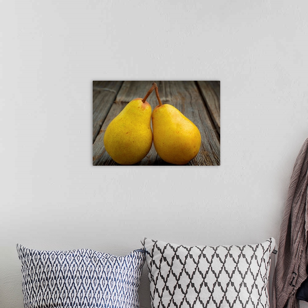 A bohemian room featuring Fresh organic pears on old wood surface.