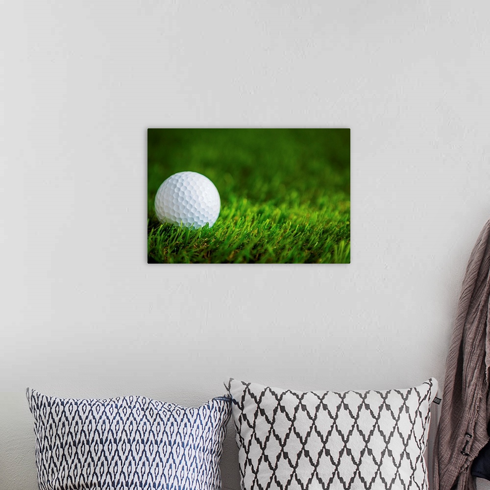 A bohemian room featuring Golf ball on green grass.