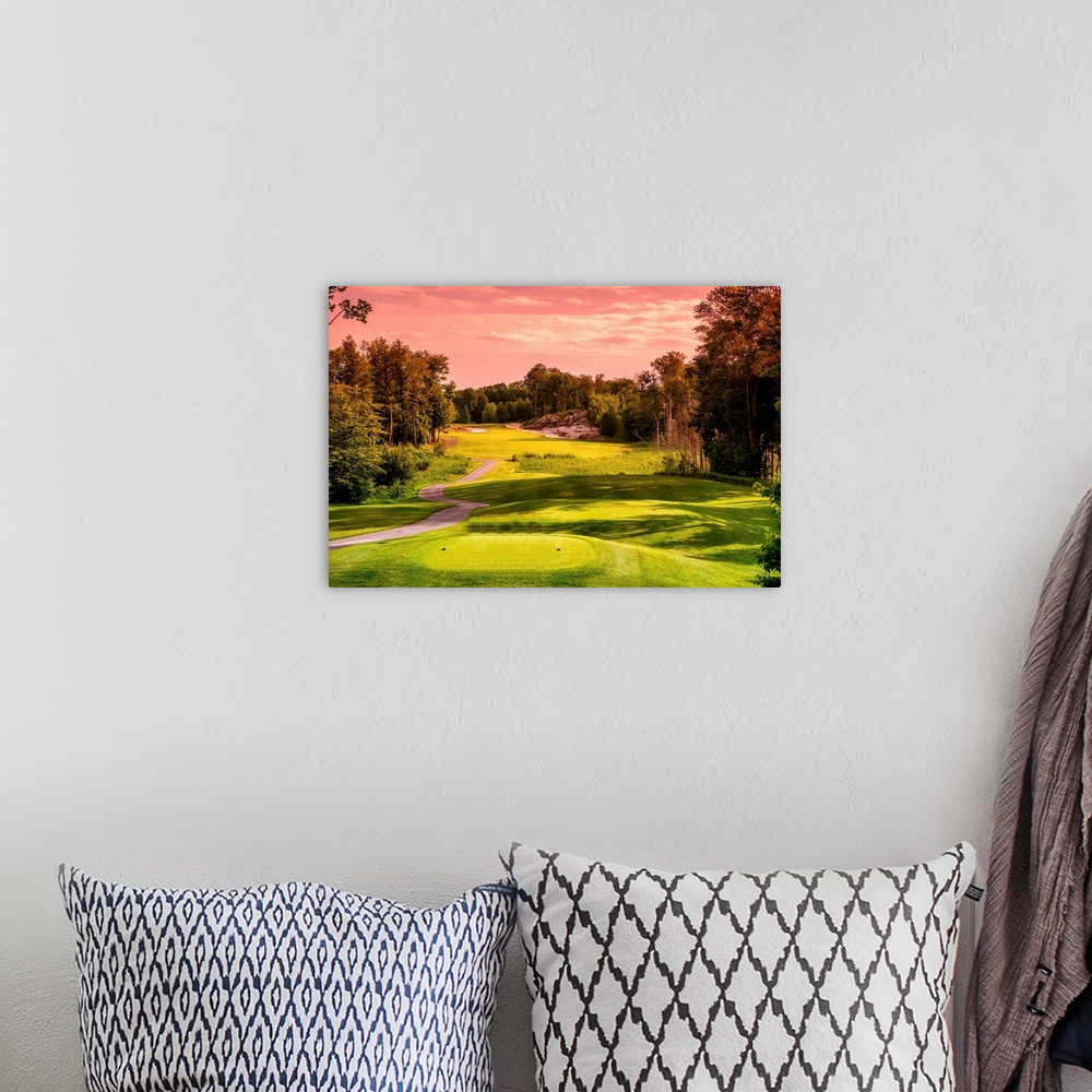 A bohemian room featuring Golf course bathed in light of a sunset.