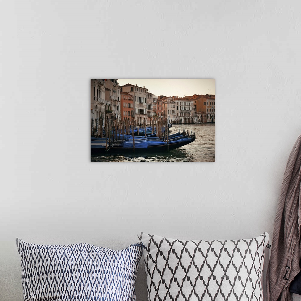A bohemian room featuring Gondola Park In Water In Venice Canal With Historical Buildings, Italy