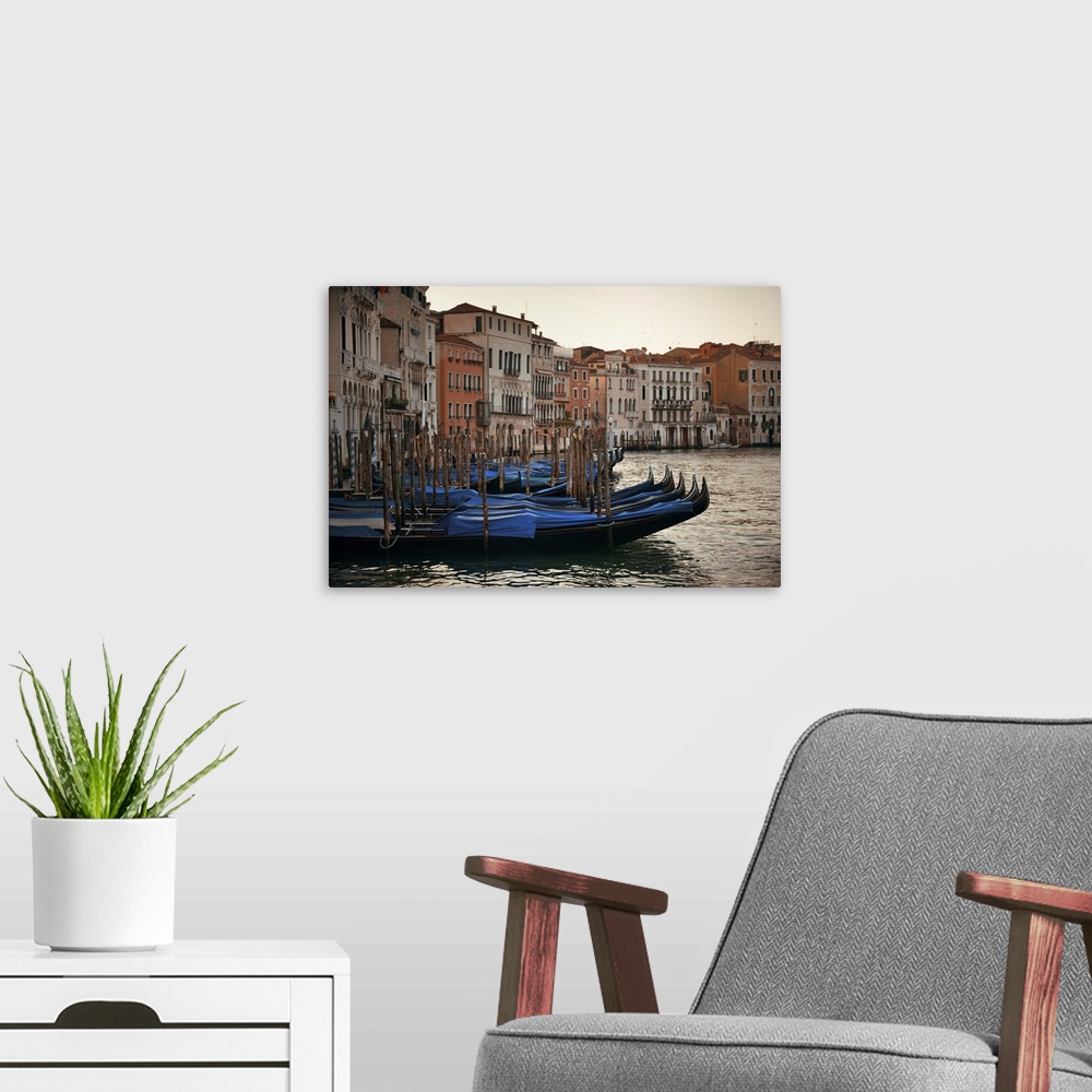 A modern room featuring Gondola Park In Water In Venice Canal With Historical Buildings, Italy