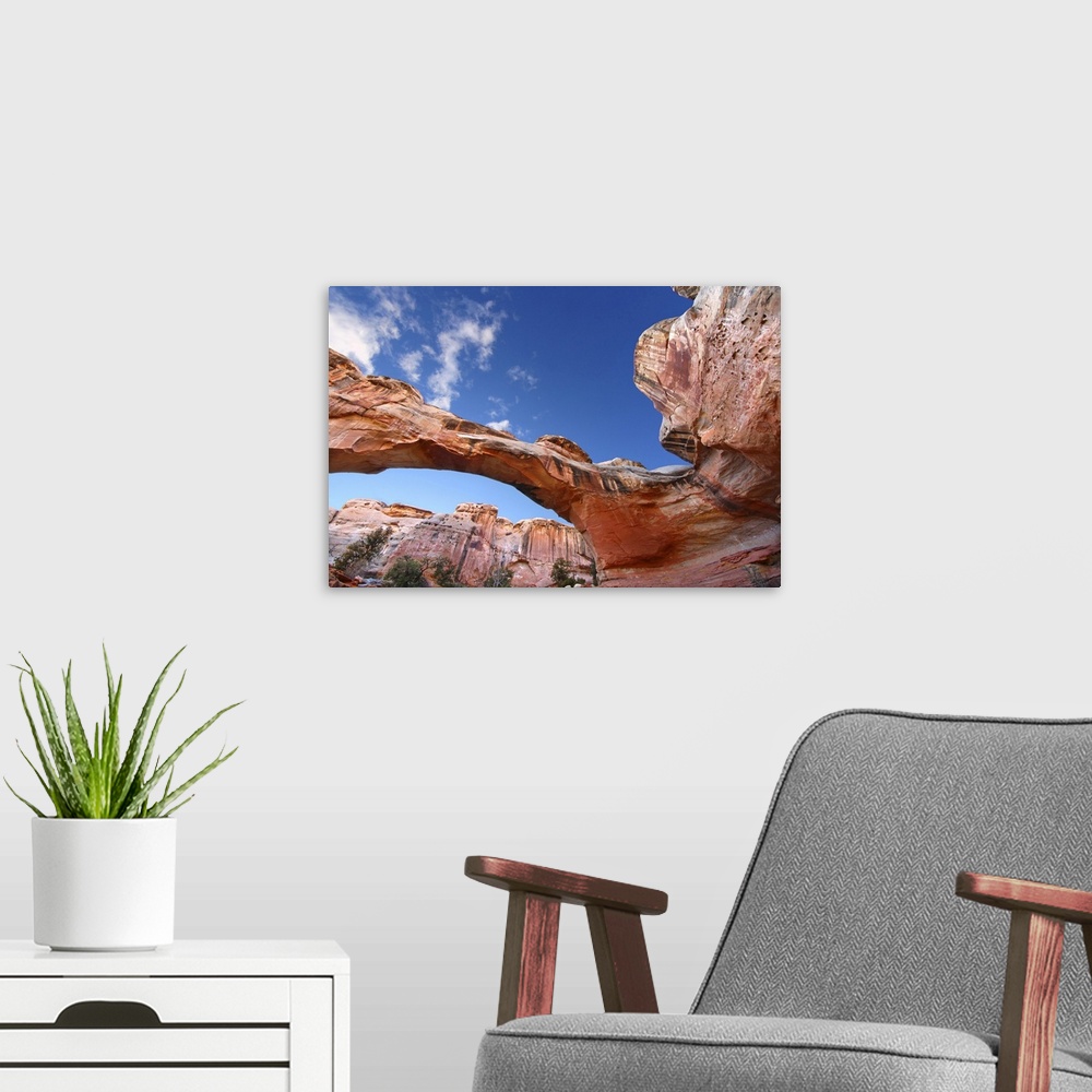 A modern room featuring Hickman Natural Bridge Spans A Canyon At Capitol Reef National Park Of Utah