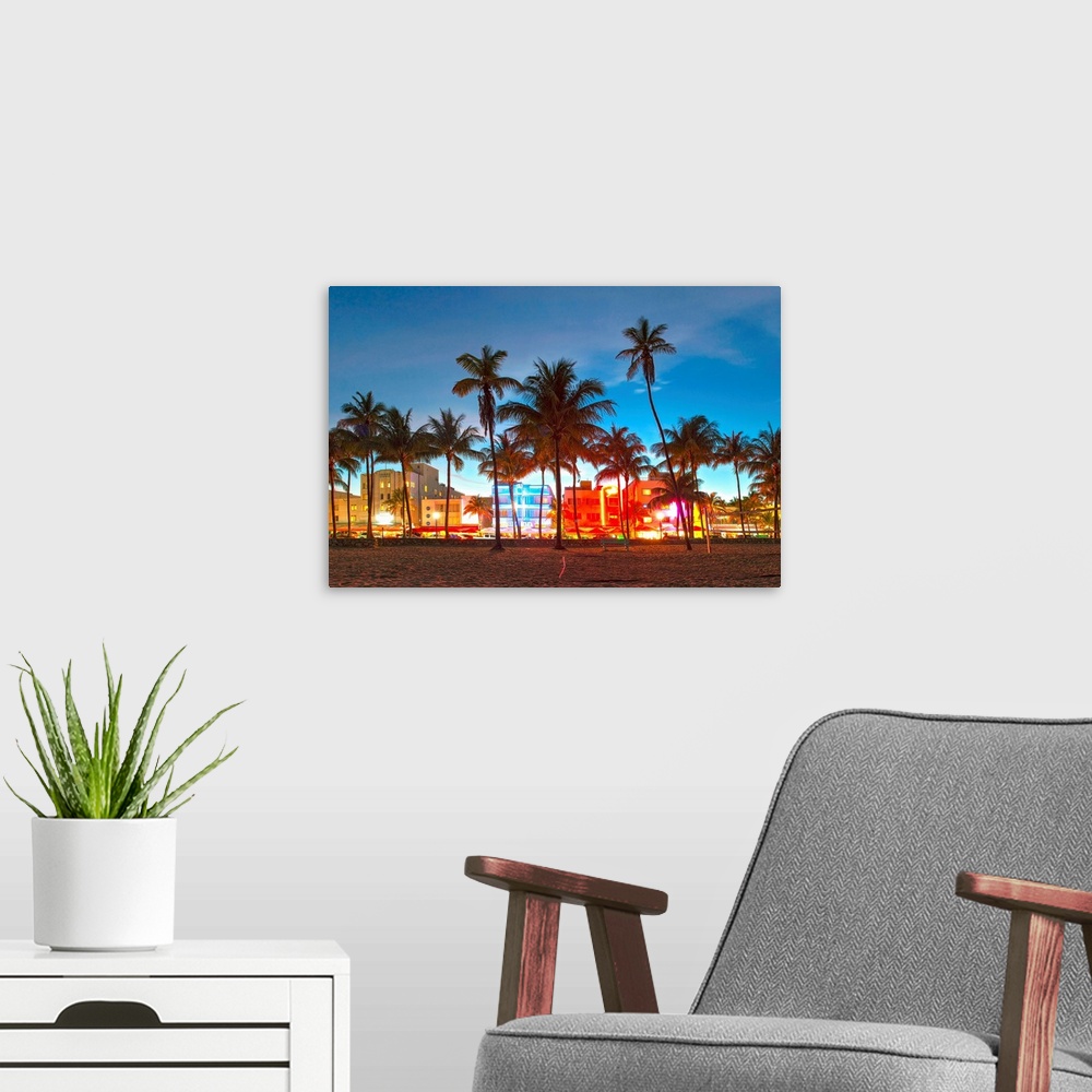 A modern room featuring Miami Beach Florida hotels and restaurants at sunset