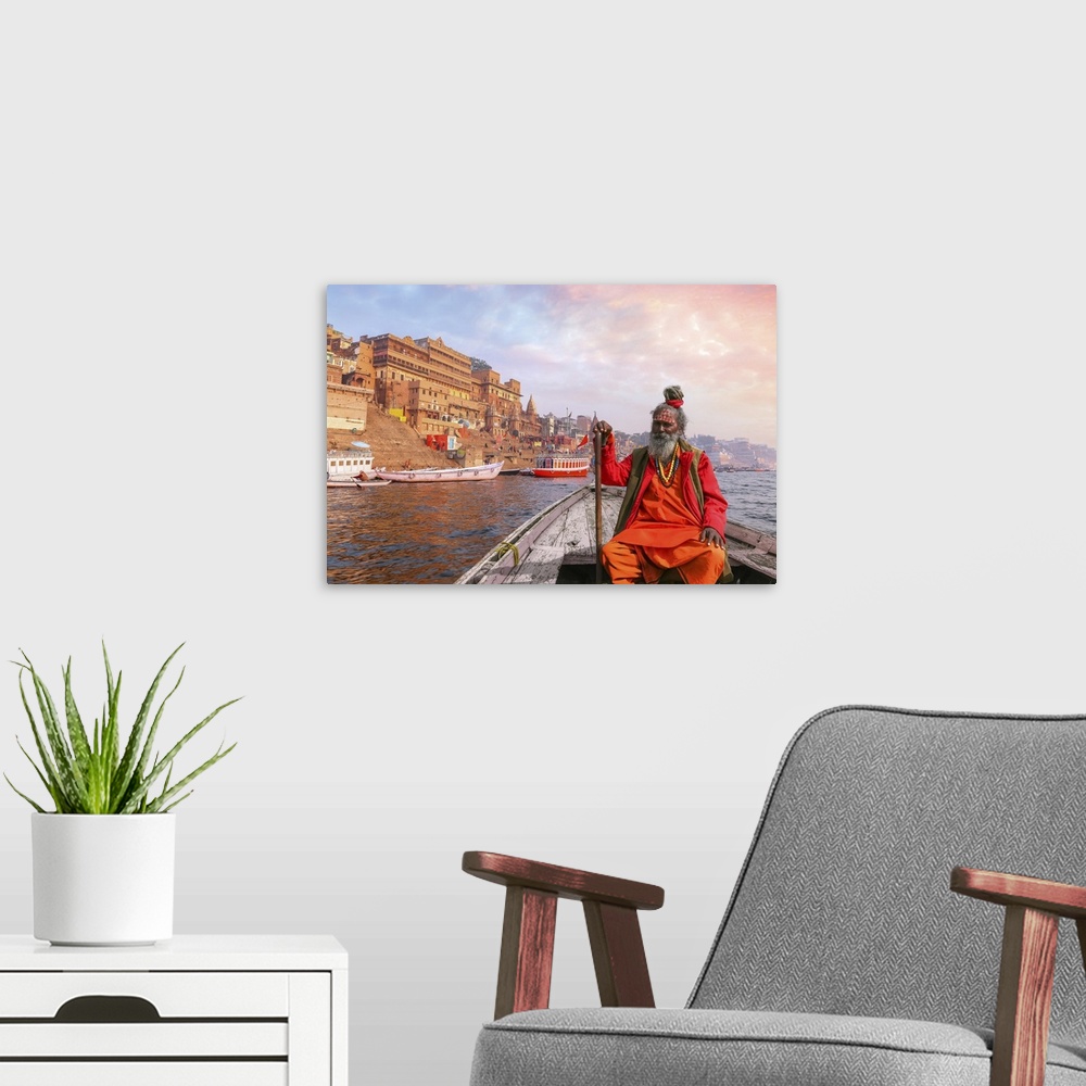 A modern room featuring Indian Sadhu Baba Takes A Boat Ride On River Ganges Overlooking Varanasi City At Sunset