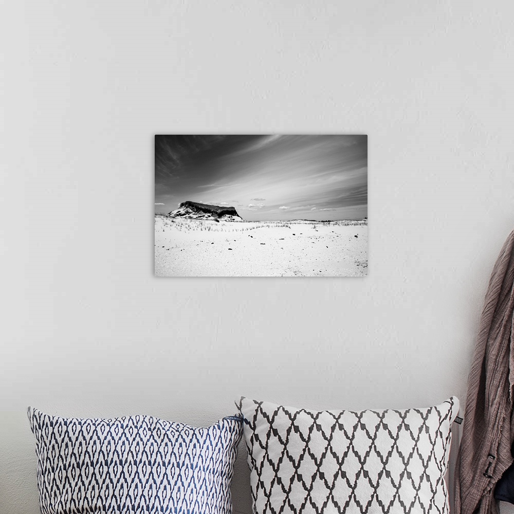 A bohemian room featuring A black and white shot of a Jersey Shore sand dune against a cloud streaked sky at Island Beach S...
