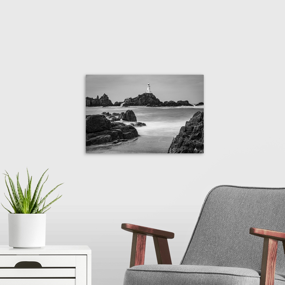 A modern room featuring High tide covers the causeway leading to La Corbiere lighthouse, Jersey, Channel Islands, UK.