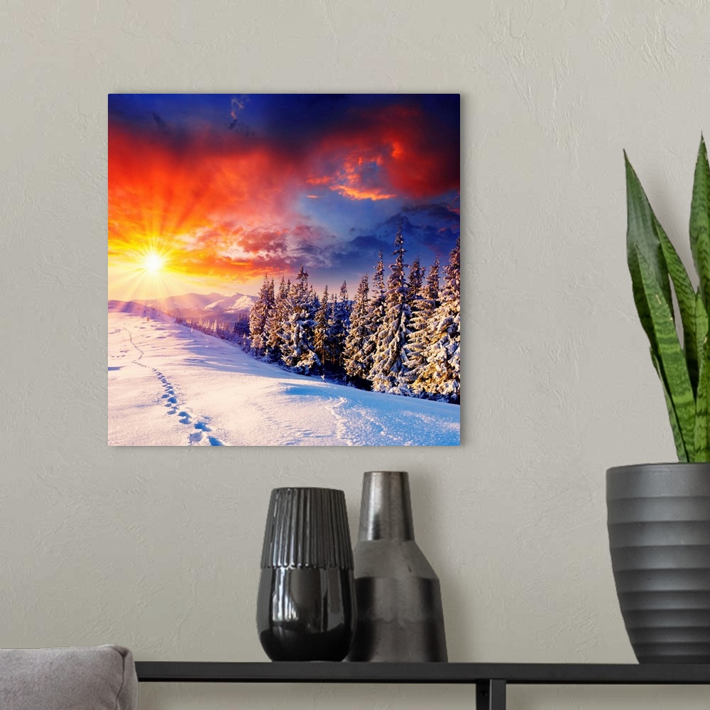 A modern room featuring majestic sunset in the winter mountains landscape. HDR image