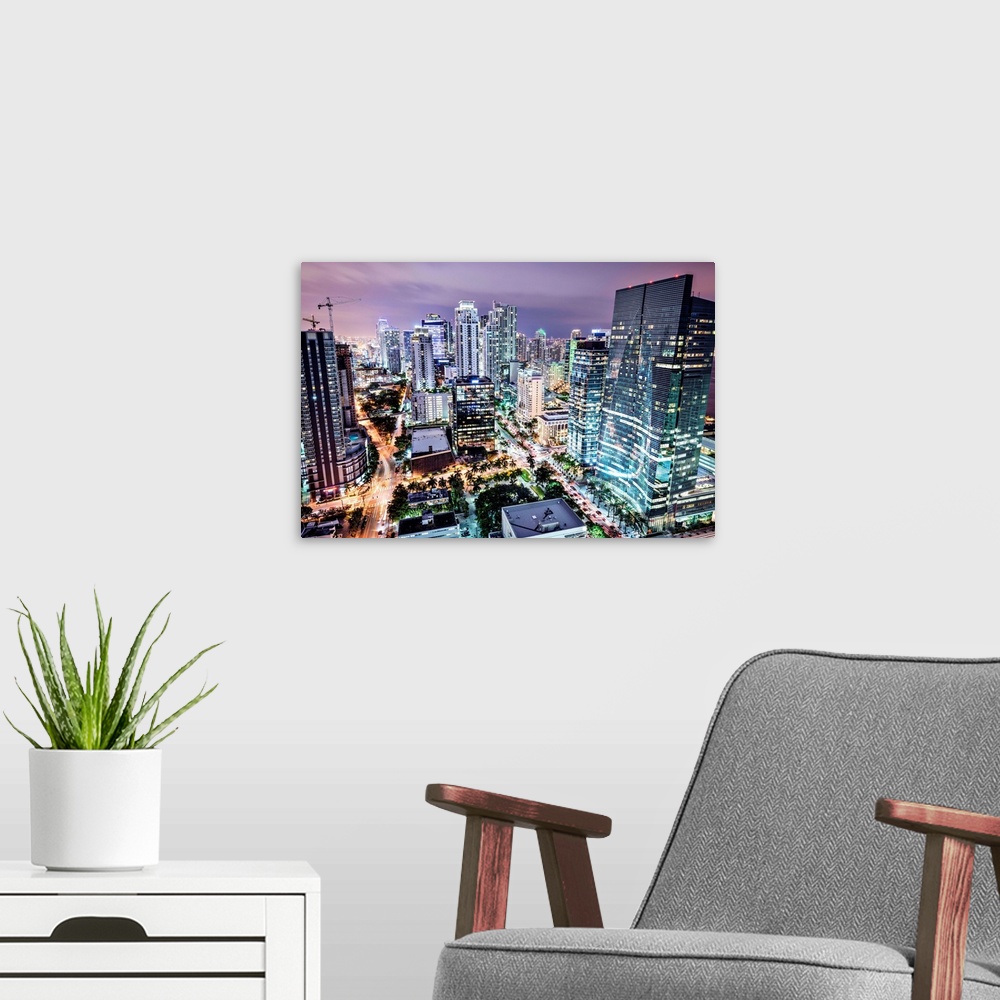 A modern room featuring Miami, Florida cityscape at night.