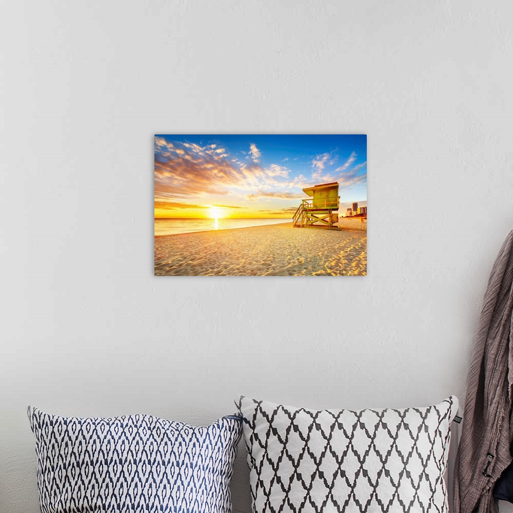 A bohemian room featuring Miami South Beach sunrise with lifeguard tower and coastline.