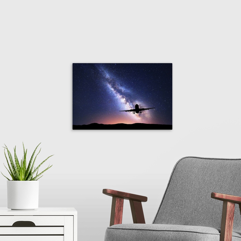A modern room featuring Milky Way And Silhouette Of A Airplane