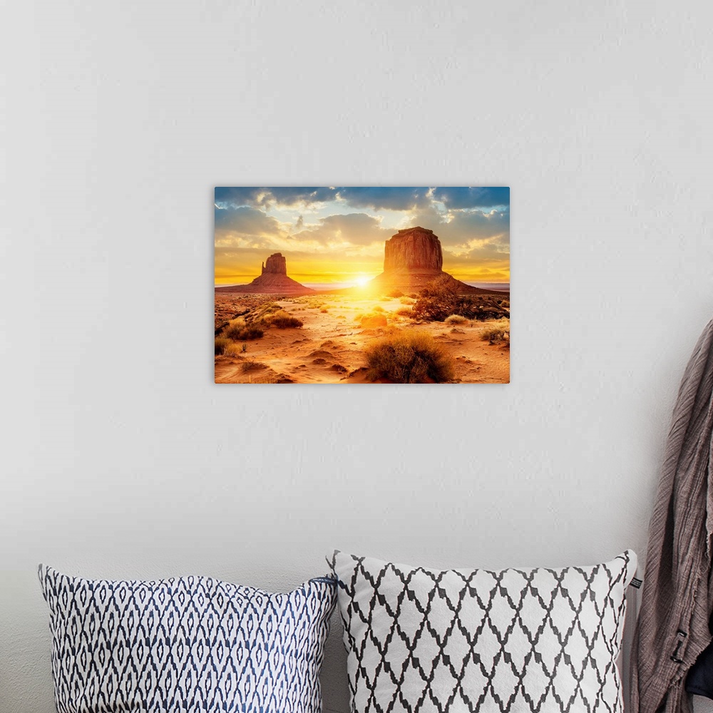 A bohemian room featuring Sunset at the sisters in Monument Valley, Arizona.