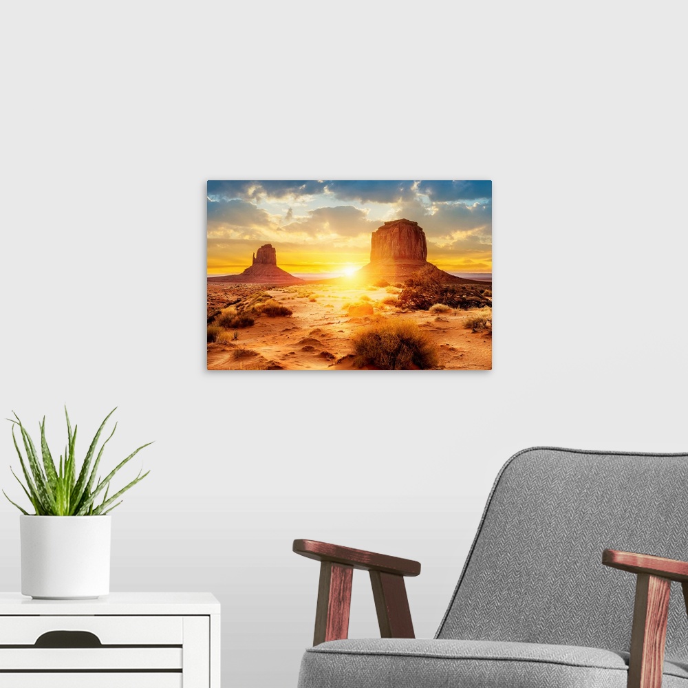 A modern room featuring Sunset at the sisters in Monument Valley, Arizona.