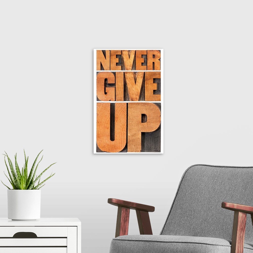 A modern room featuring never give up - isolated phrase in vintage letterpress wood type, scaled to rectangle
