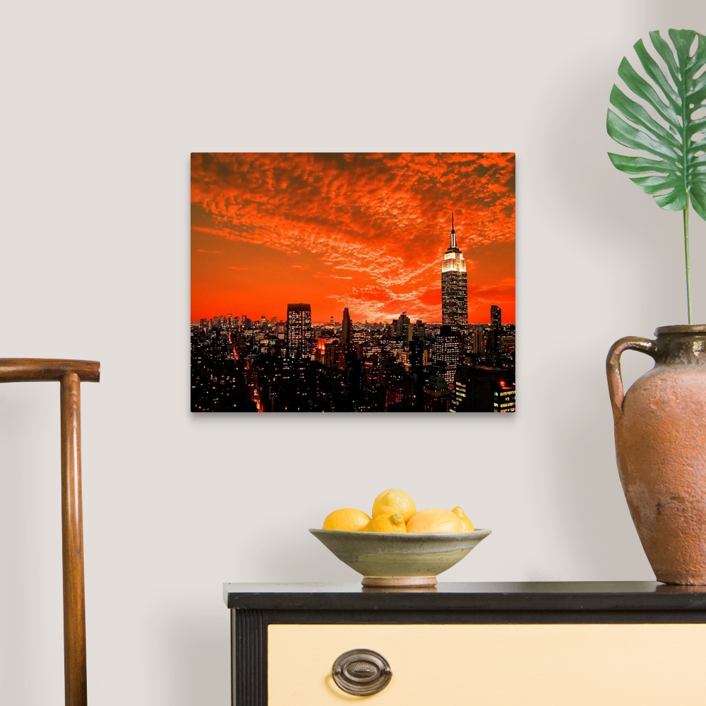 A traditional room featuring The New York City midtown skyline under dramatic clouds.